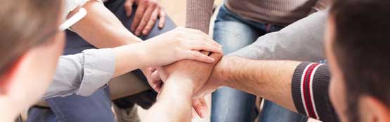 Group of people connecting hands