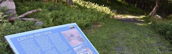 Erie Canal sign on path