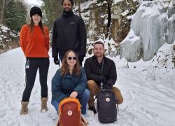 a group of people posing for a picture in the snow